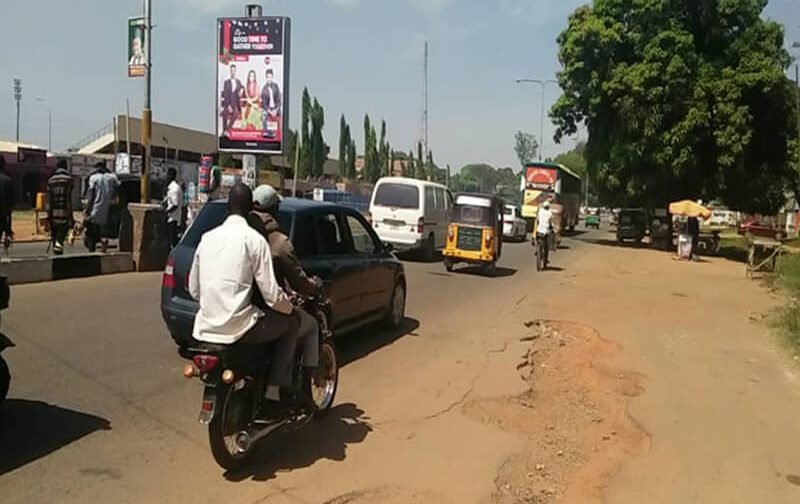 Kaduna Portrait board Along Independence Way By Ranchers Bee Stadium FTT City Centre, Central Market (AM)