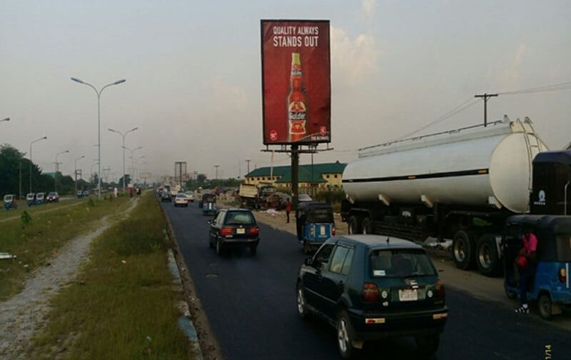 Warri Portrait board Along Effurun PTI Road by Wellington Hotel FTT   Effurun Roundabout (AM)