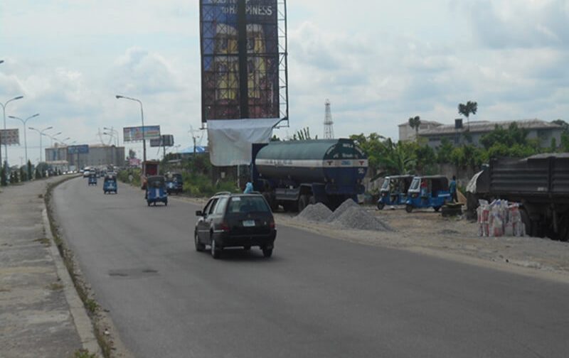 Warri Portrait board Along Port Harcourt Road by Navy Fence, Warri (AM)